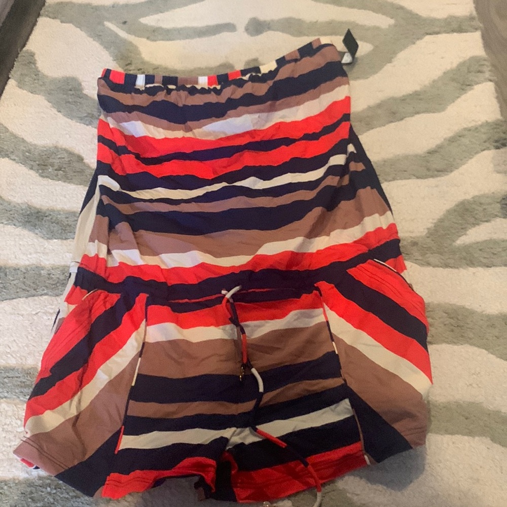 Romper with pockets. Ties at the waist